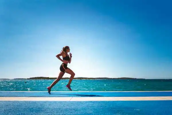 Woman running showing strong leg muscle Didcot
